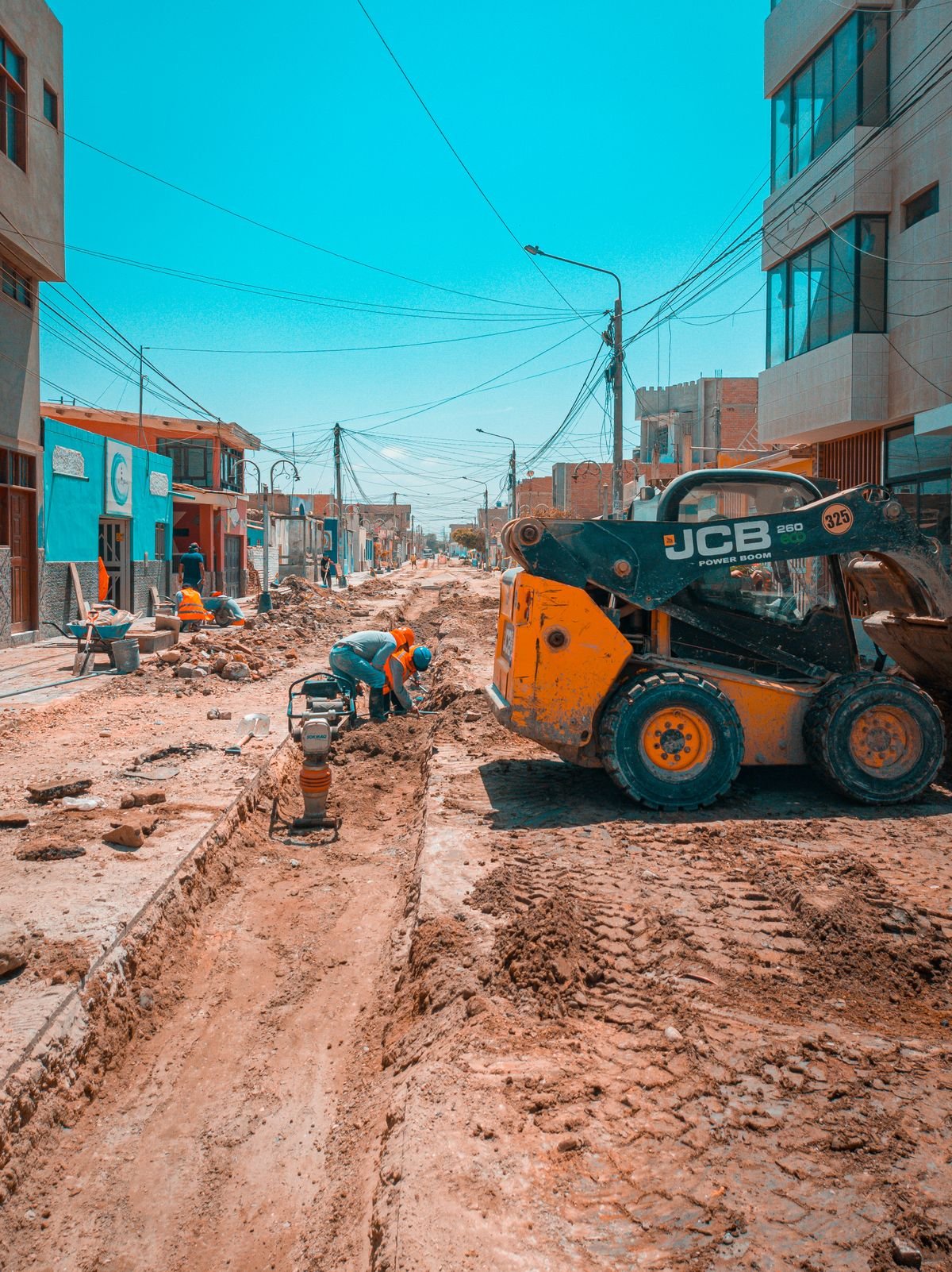 Road construction execution with workers and machinery