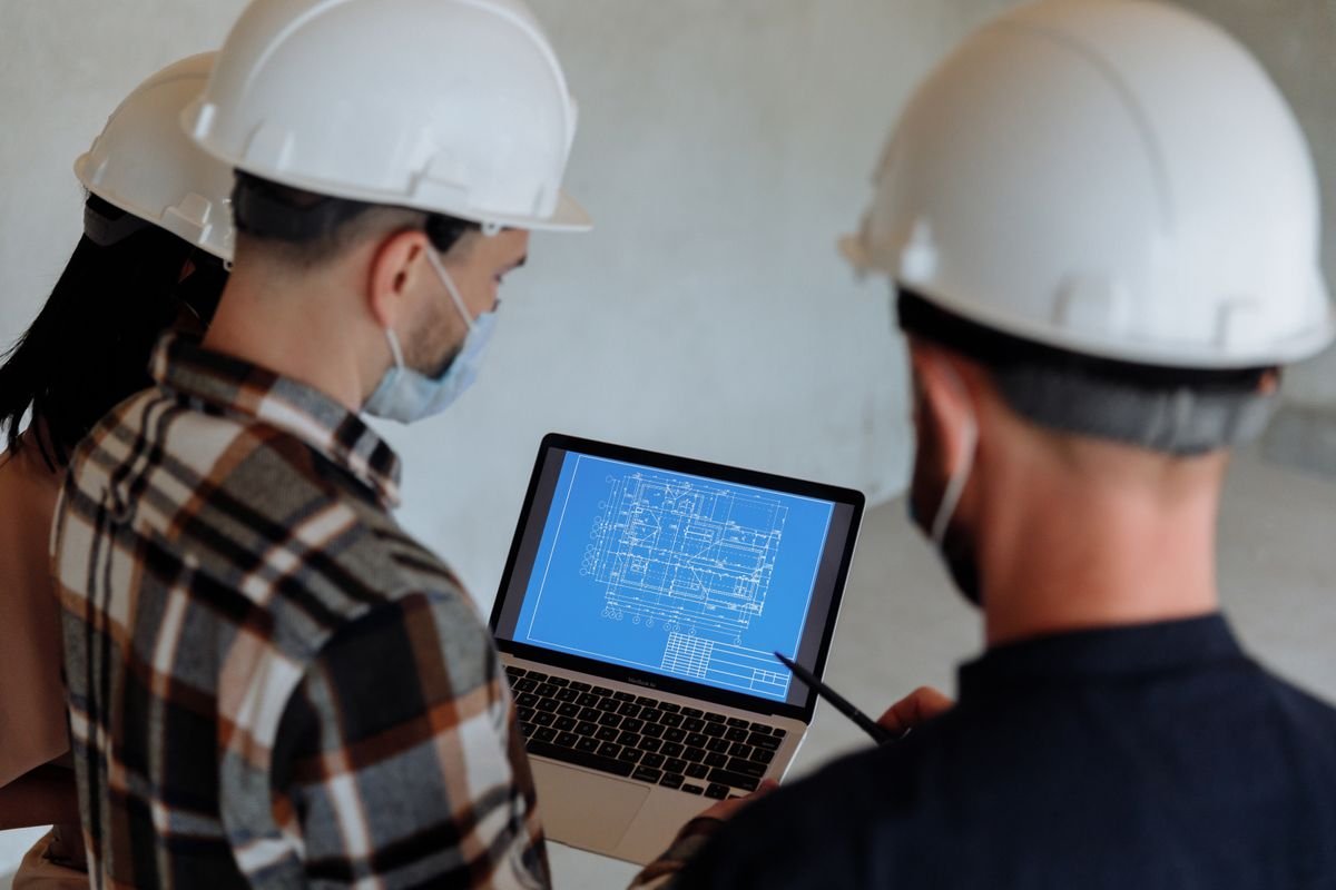 Engineers reviewing construction plans